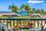 Lanai with Ocean Views and Sunset Exposure. Flowers and items shown are for staging purposes only.